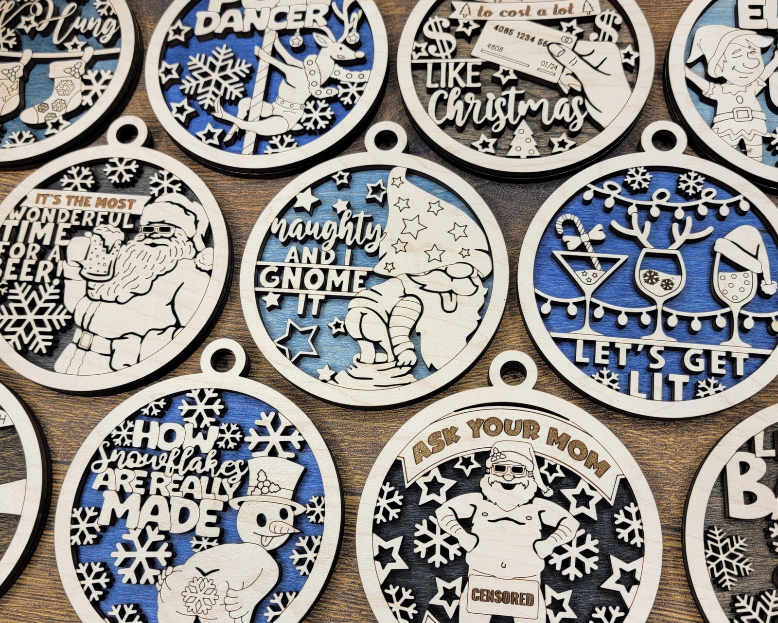 Layered maple Christmas ornaments with laser-cut designs